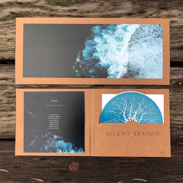 ASC — The Waves (SSCD22), CD and packaging laid out on wood