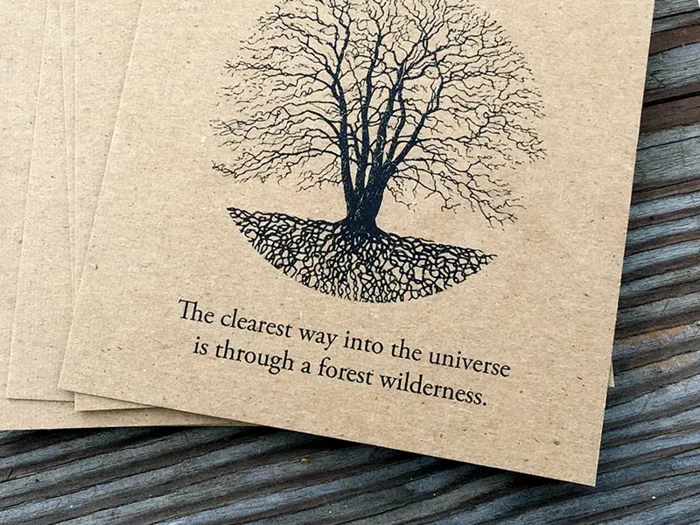 Silent Season tree print and forest wilderness quote on a kraft sleeve